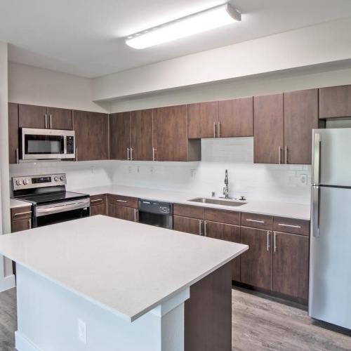 Spacious kitchens with thoughtful details a kitchen with wooden cabinets