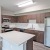 a kitchen with wooden cabinets